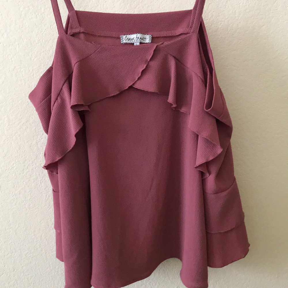 This is a pink off the shoulder ruffled top.